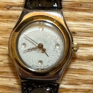 Swatch  Swiss Irony Lady Reverence Black band and Gold  Rim Classic Timepiece